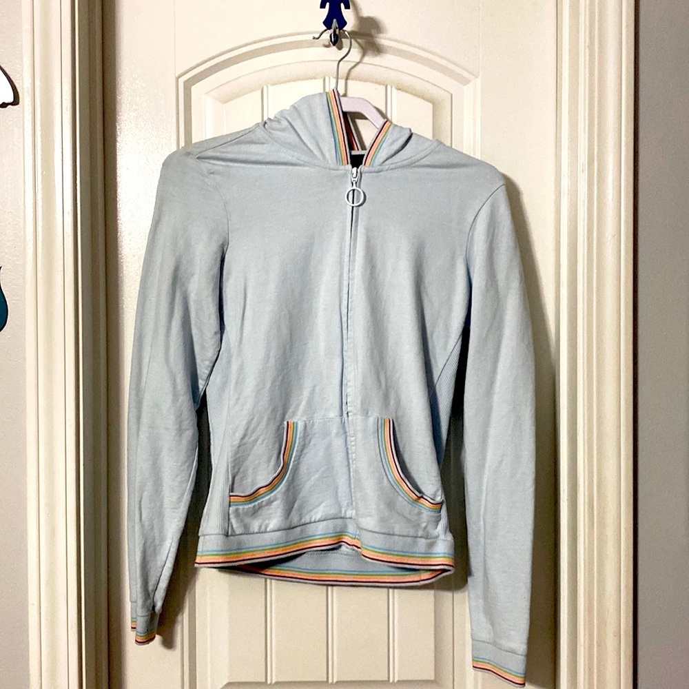 A thin worn hoodie with a bit of color
